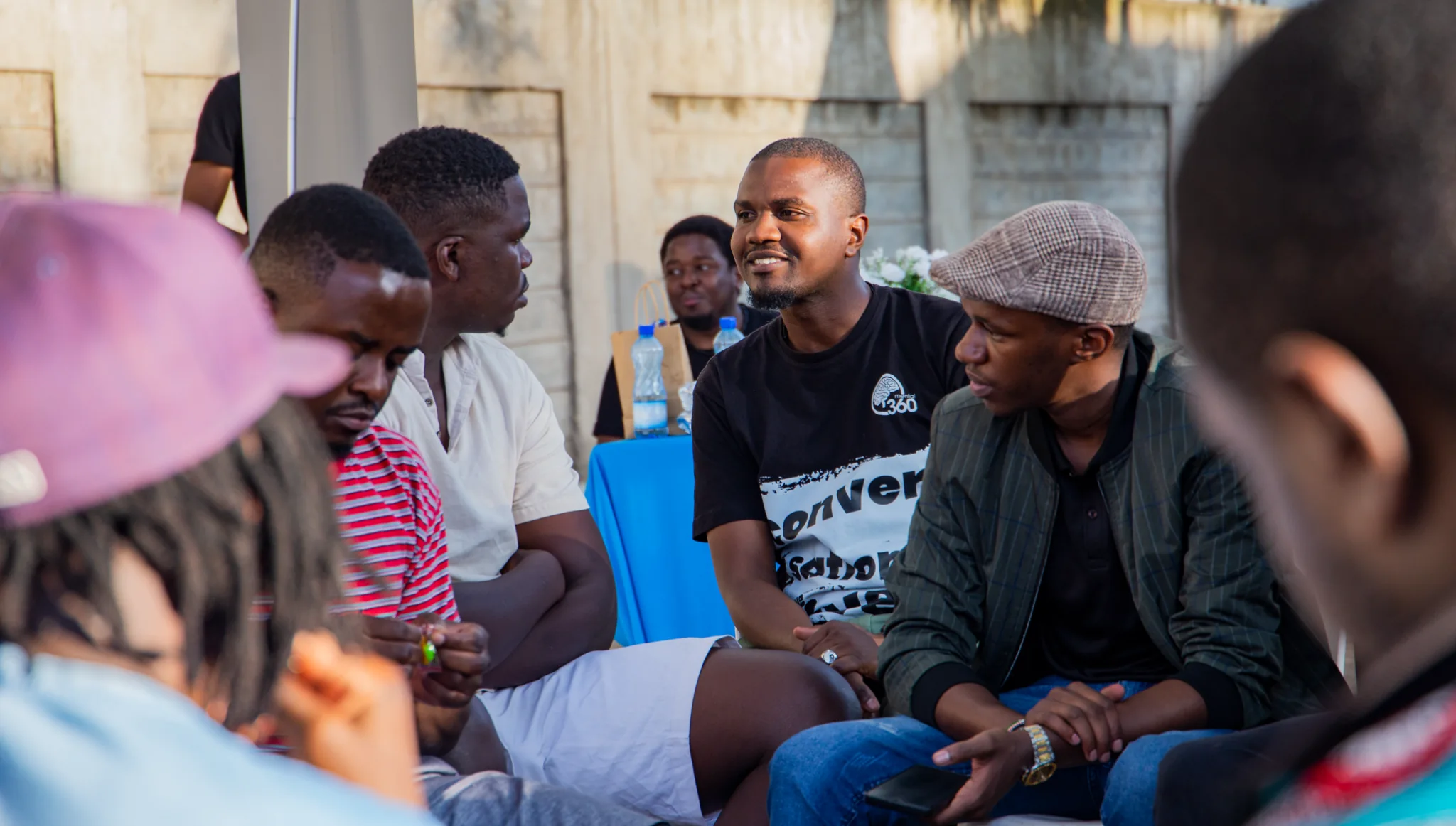 Young people gathered in conversation at a Mental 360 event